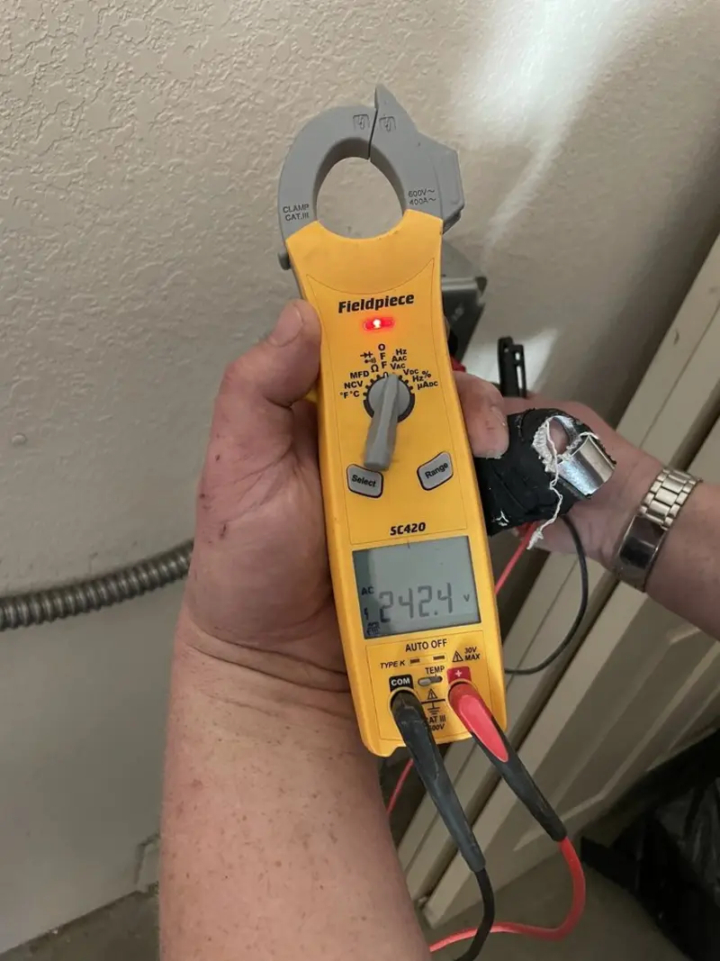 Voltage testing with clamp meter during Outlet Installation in Lugoff